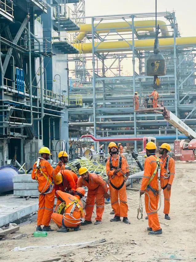 A construction team at work in an industrial setting